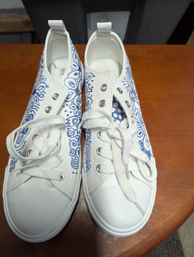 New Woman's white with blue flowers sneakers / tennis shoes size 11