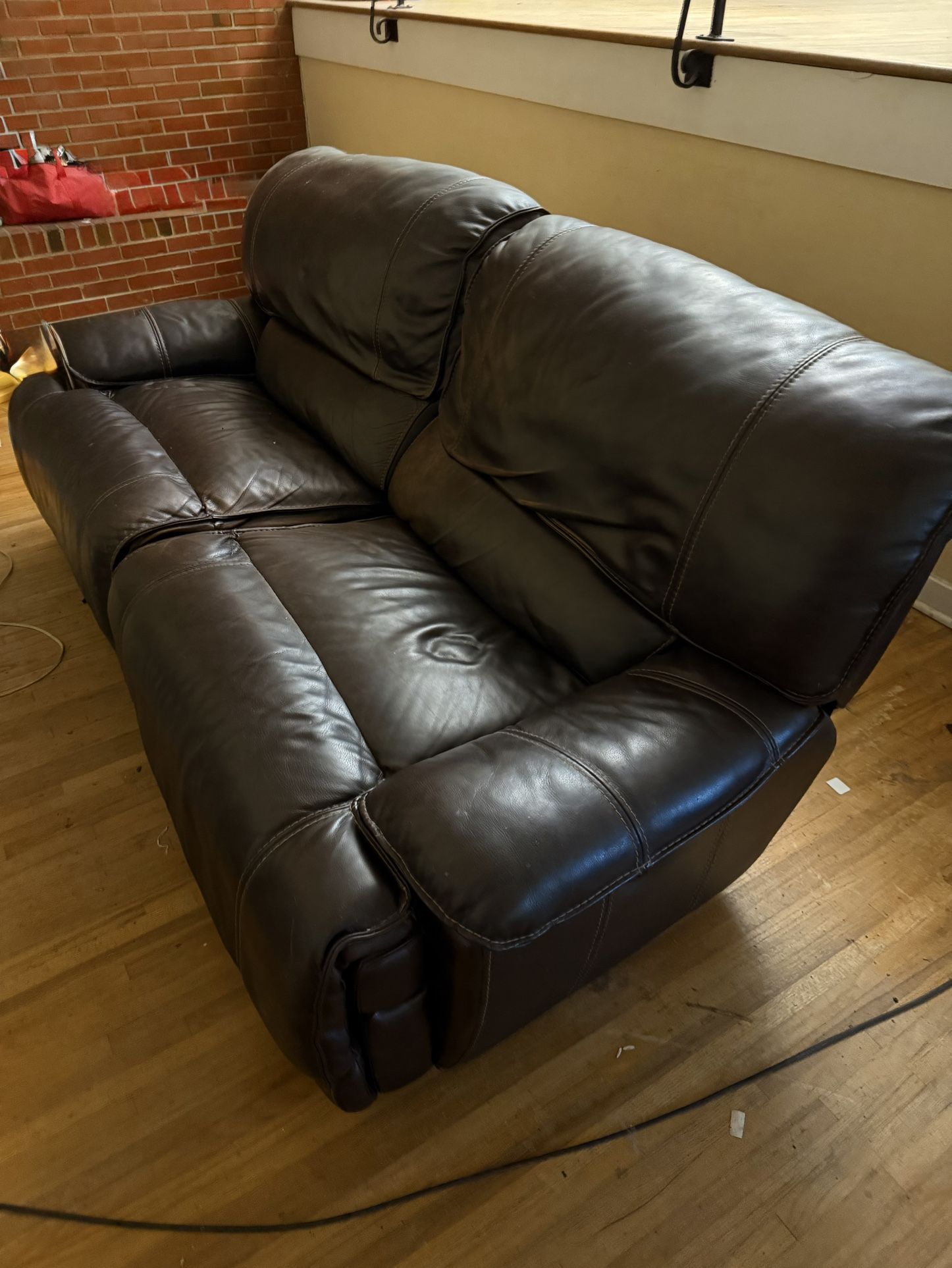 Haverty’s Dark Leather Reclining Couch