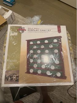 Golf ball display unopened