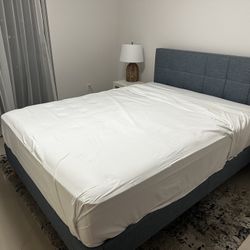 Brand queen upholstered bed frame with used Sealy PosturePedic 11” mattress