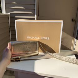 Michael Kors Jet Set metallic gold crossbody bag. 