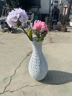 Metal vase with flowers