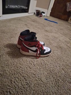 Nike Air Jordan's, red, white, and black