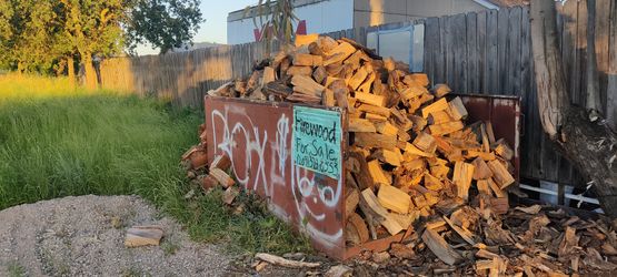 Firewood For Sale $20 In Wheelbarrow