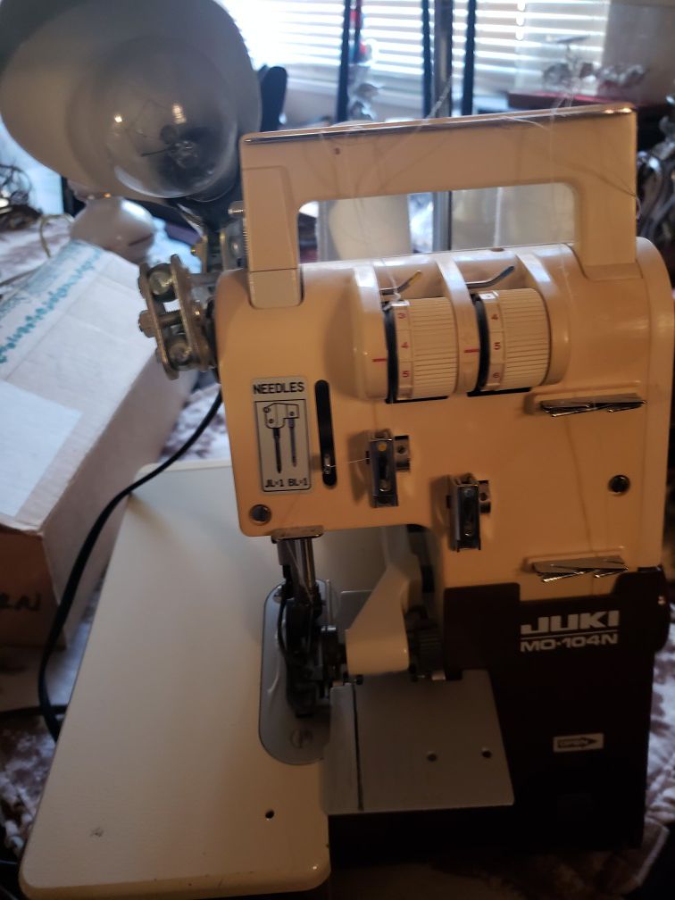 Serger with parts and accessories
