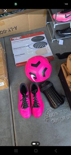 Soccer shoes ,ball, and pads