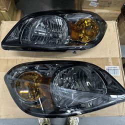 Headlights For 2005 To 2010 Chevy Cobalt/ 2007 To 2010 Pontiac G5; Smoked Lens With Amber Corners 