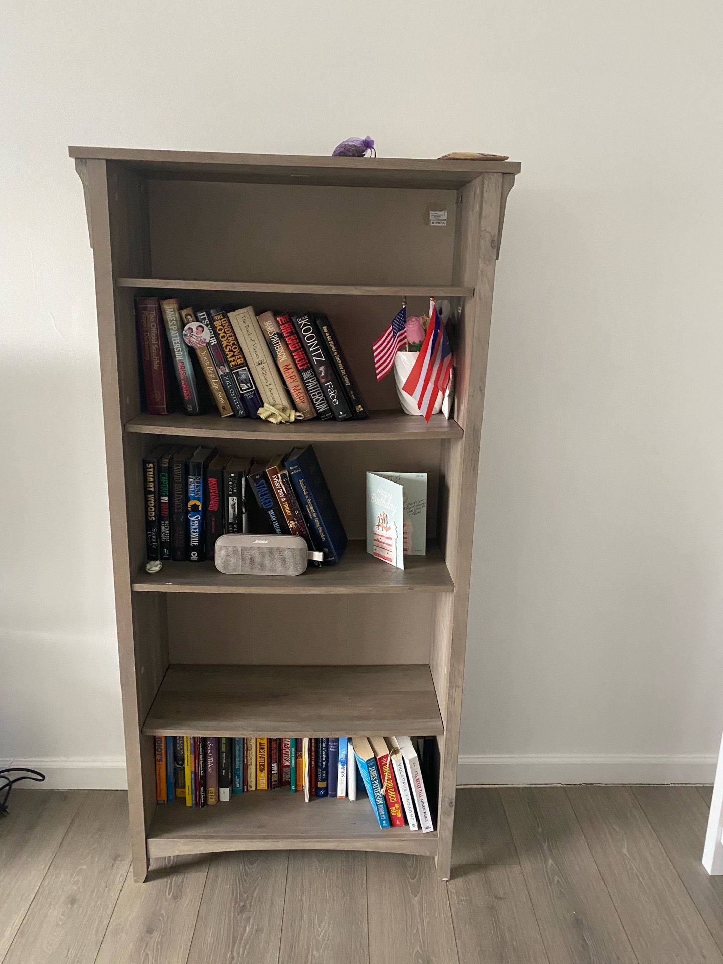 Tall grey bookcase