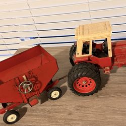 Vintage ERTL metal tractor and matching spreader toy