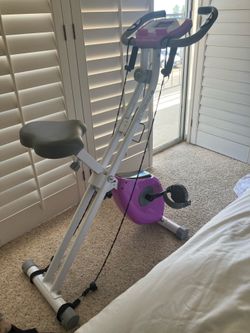 Stationary spin bike with resistance bands