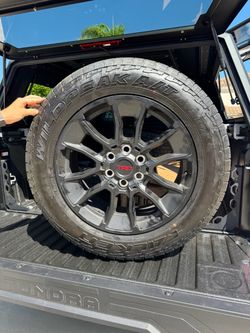 OEM Toyota TRD Off-Road wheels and Falken Wildpeak all-terrain tires removed from a 2026 Toyota Tundra. Tires have only 100 miles on them.