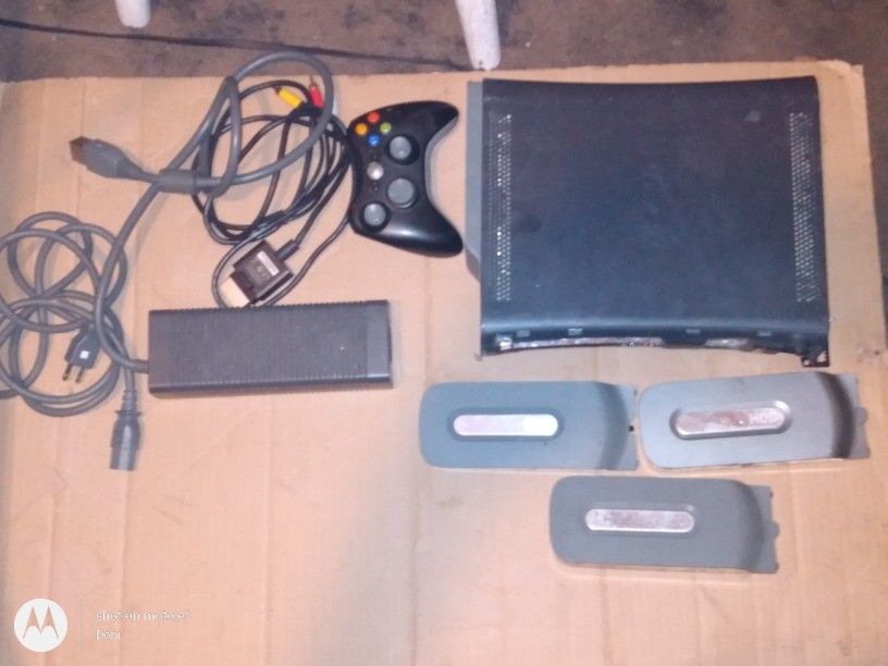 xbox 360 includes controller, power cords, a/v cord & 4 hard drives