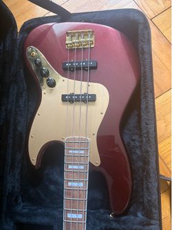 Squier 40th Anniversary Jazz Bass, Gold Edition – Ruby Red Metallic