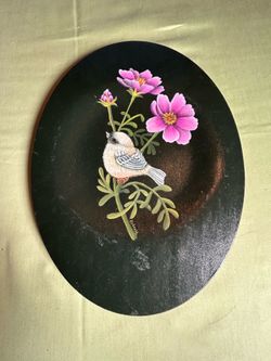 Handpainted on oval black material