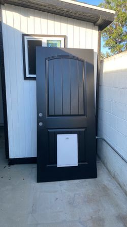 Exterior door with doggy door 16”by  10 1/2