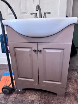 Bathroom sink and cabinet