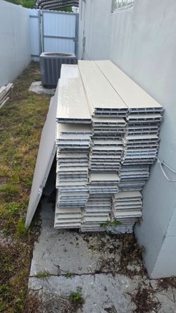 130 feet of white PVC and brown PVC