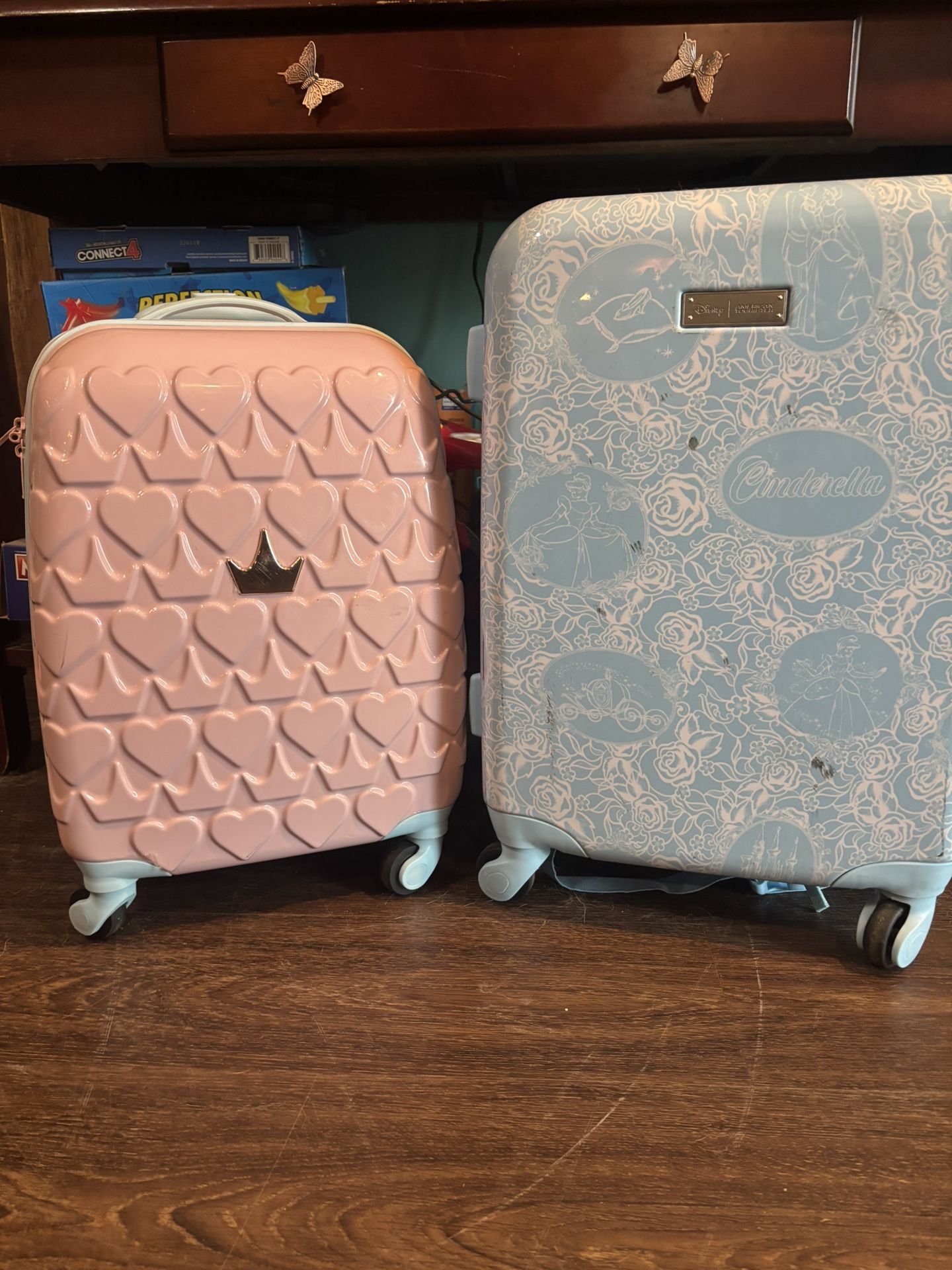 Gently Used Cinderella Rolling Suitcases.