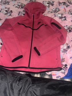 Pink and black Nike tech