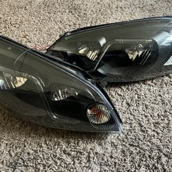 09 Chevy Impala Headlight Assembly (Blacked)