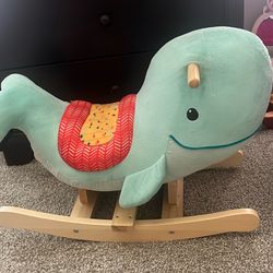 Kids rocking whale