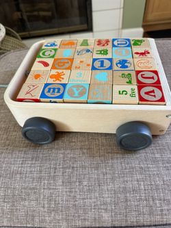 Wooden wagon with building block letters