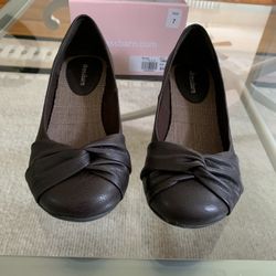 Brand new Womens size 7 Brown slip on shoes with a little wedge