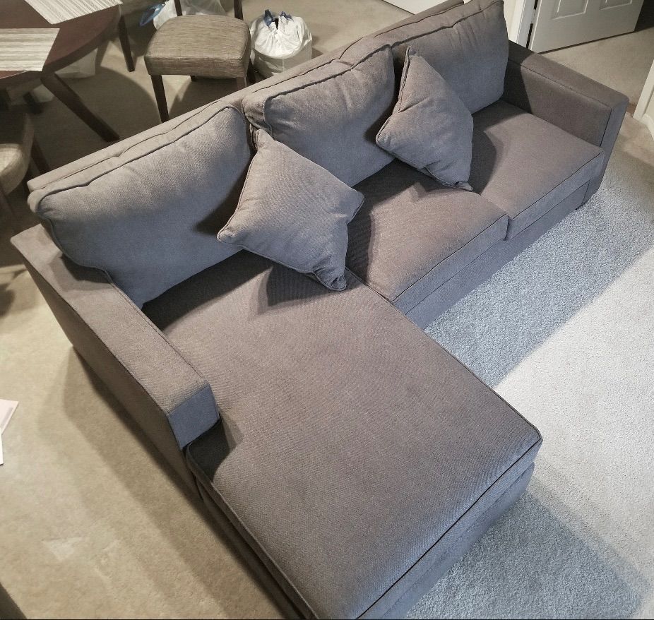 Gray Egan Sectional Sofa with Reversible Chaise by Living Spaces