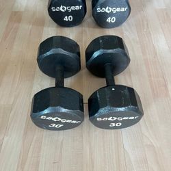 (2) 40. (2) 30 Lbs  Dumbbells 

