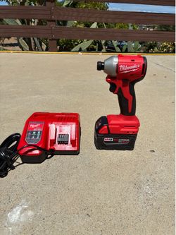 Brand New Milwaukee M18 Compact Brushless Impact Driver Kit + M18 XC 5.0 Battery & Rapid Charger