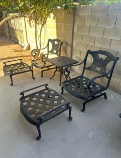 Patio set. Hanamint. HEAVY! Rocking chairs with side table and ottomans. Very nice.