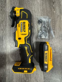 Powerful DeWalt 20V Brushless oscillating multi-tool. It includes a 20V 2Ah battery. Has accessories in a bag.