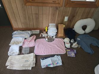 Lot of baby items, diapers, cloth diapers, towels, Boppy with 2 covers etc