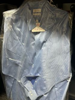 (4) Mens 3XL dry cleaned shirts