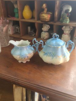 Antique hand painted violets floral porcelain sugar and creamer set