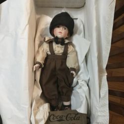 18-inch porcelain doll from The Franklin Mint is a limited edition collectible from the Coca Cola Doll Collection