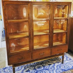 Mid-Century Modern bookcase wall unit designed by Merton Gershun for American of Martinsville's Dania collection. 