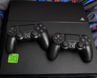 PLAYSTATION 4 cords and 2 controllers
