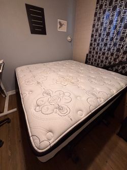 King Sized Mattress and Gray Upholstered Frame