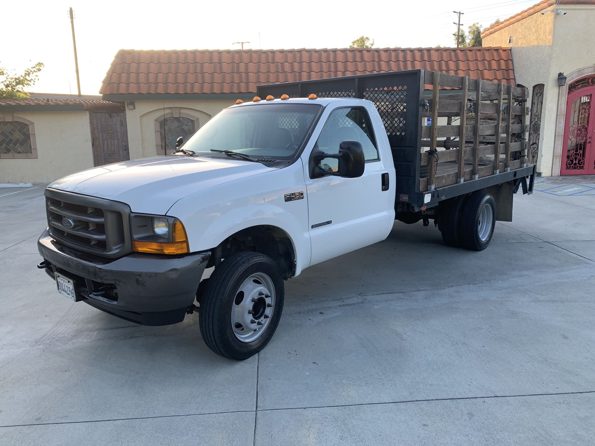 2001 Ford F450 7.3 diesel 12 foot flatbed truck with lift gate only 76,000 original miles runs excellent