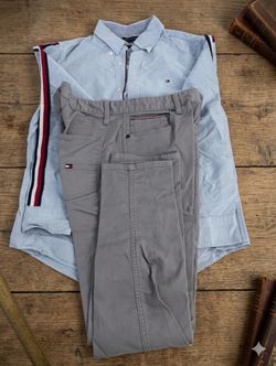 Tommy Hilfiger light blue button-down shirt and gray pants
