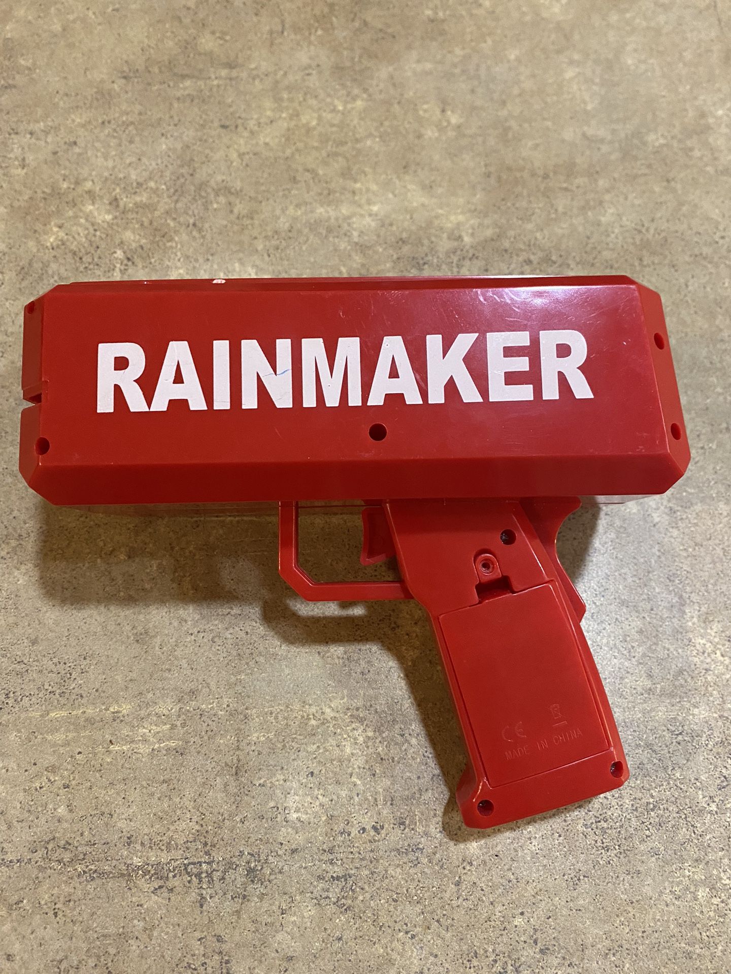 Red Rainmaker Toy Gun Shoots Out Money