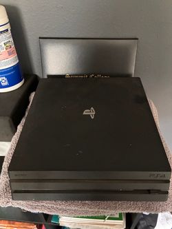 PS4 with controller and headset
