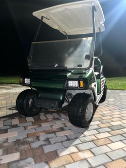 Green Golf Cart with LED Headlights