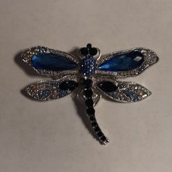 Silver-tone dragonfly brooch with blue stones 