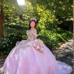 Elegant Pink Quinceañera Ball Gown with Gold Accents, Sparkling Crown & Bow