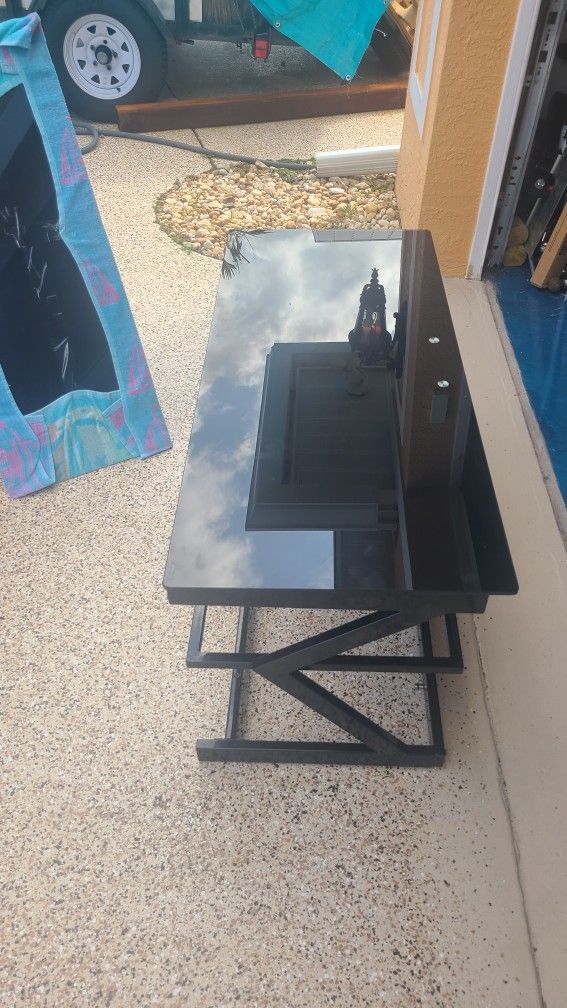 TV Stand. Missing The Adjustment Feet...perfect Condition Otherwise. Three Glass Shelves.