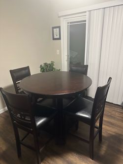 Cherry wine bistro table with four chairs
