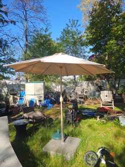 Prices firm.. beautiful 9-ft patio umbrella with stand