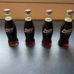 4 Coca Cola Bottles